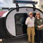 Owner(s) standing next to their Bean Trailer