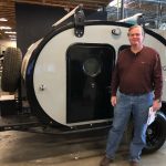 Owner(s) standing next to their Bean Trailer