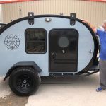 Owner(s) standing next to their Bean Trailer