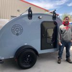 Owner(s) standing next to their Bean Trailer