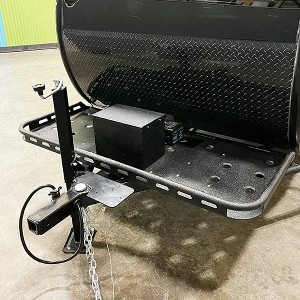 Front storage rack with trailer jack and battery box.