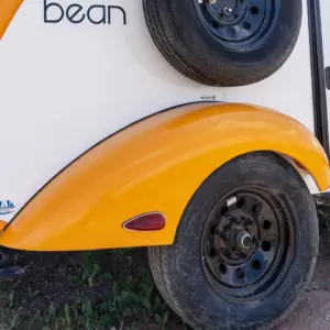 Fiberglass sculpted fender now finished in tough Raptor Liner