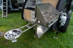 Partner Steel two burner stove with rack-out. Optional Discada burner accessory shown