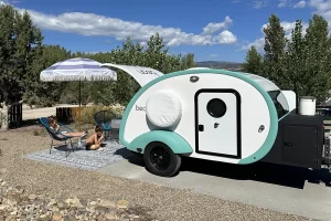Bean Trailer at a campground with kids sitting outside