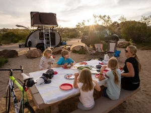 Camping with family eating lunch next to your Bean Trailer Teardrop