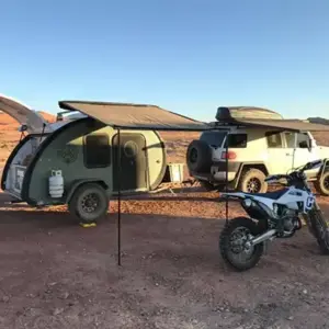 Dirt bike with a bean trailer in the background