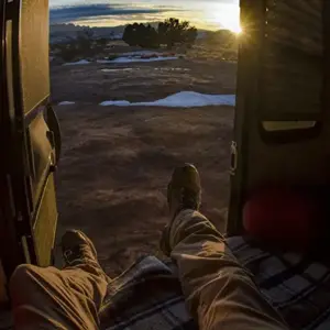 Looking out at the dawn from inside a Bean Trailer