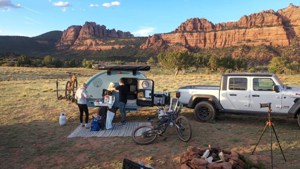 Bean Stock 2.0 at camp below red rock cliffs in southern Utah