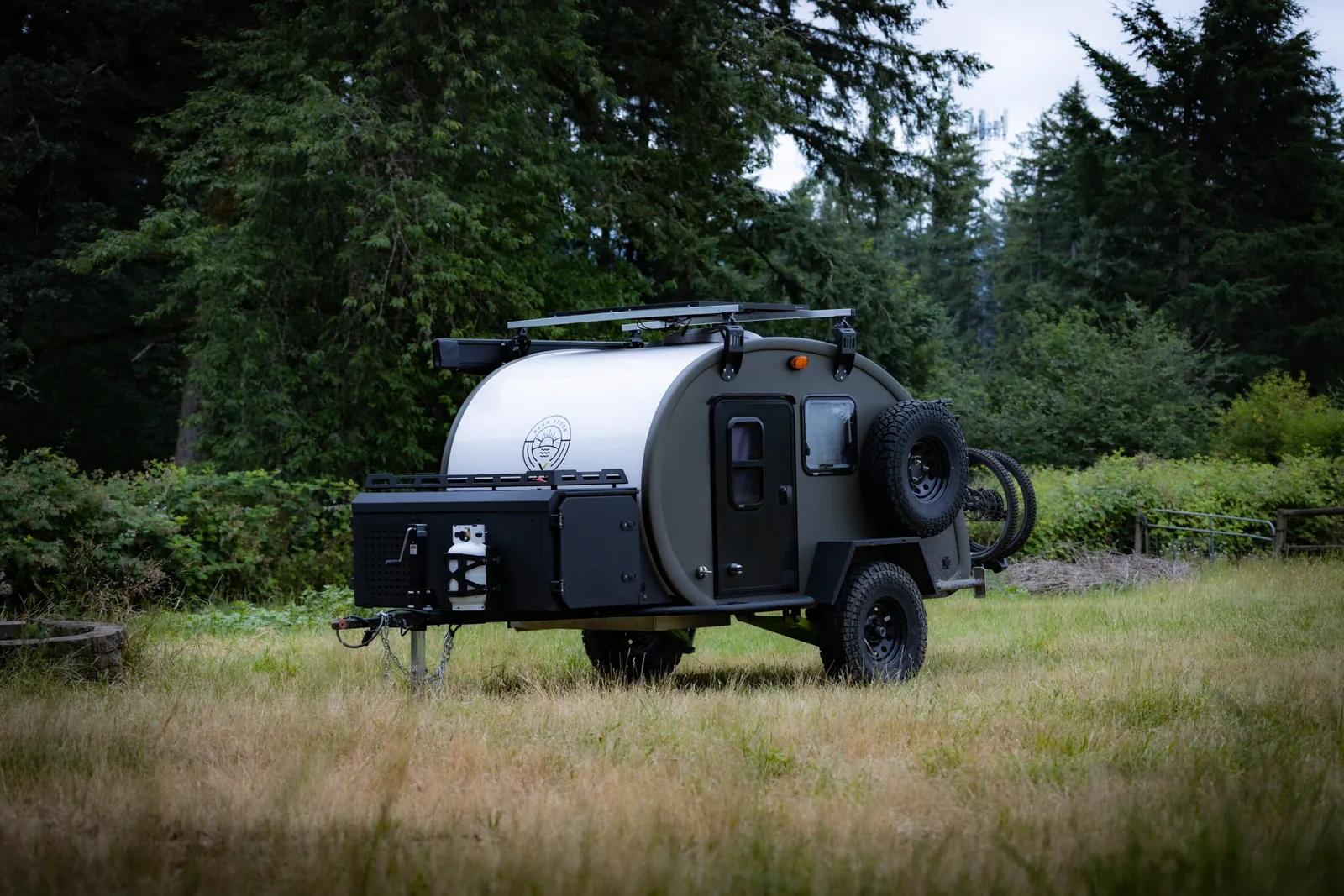 Bean Stock X parked in a mountain meadow at the edge of the forest